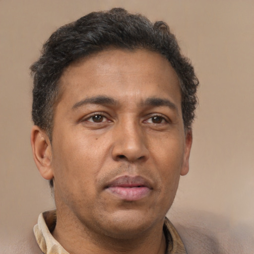 Neutral latino adult male with short  brown hair and brown eyes