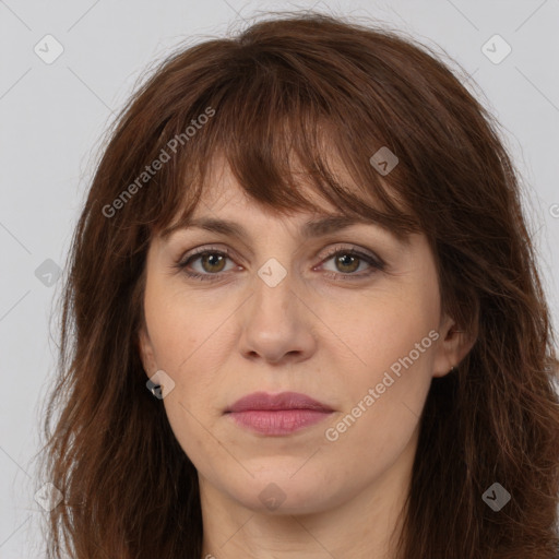 Joyful white adult female with long  brown hair and brown eyes