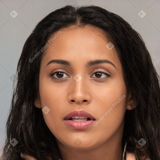 Joyful latino young-adult female with long  black hair and brown eyes