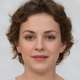 Joyful white young-adult female with medium  brown hair and green eyes