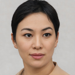 Joyful asian young-adult female with short  black hair and brown eyes