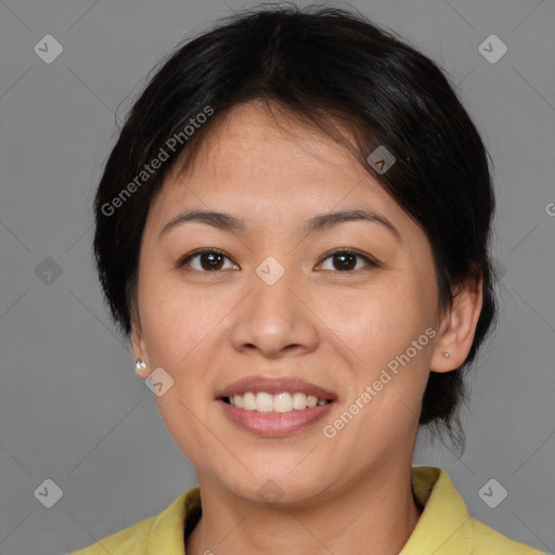 Joyful asian adult female with short  brown hair and brown eyes