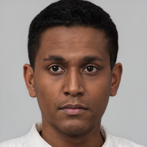 Neutral latino young-adult male with short  black hair and brown eyes