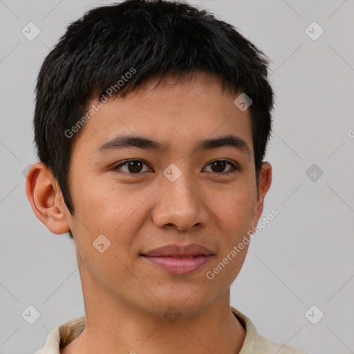 Joyful asian young-adult male with short  brown hair and brown eyes