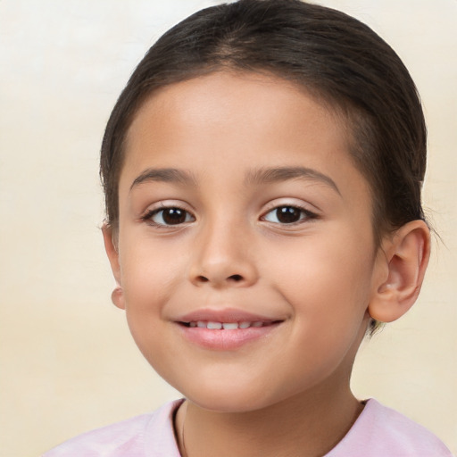 Joyful white child female with short  brown hair and brown eyes