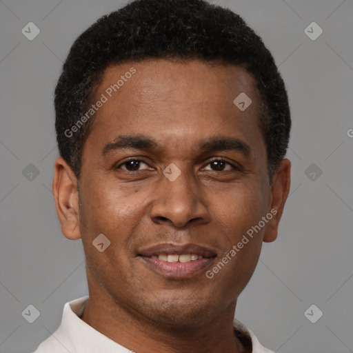 Joyful latino young-adult male with short  brown hair and brown eyes