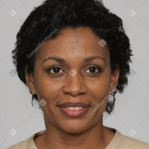 Joyful black adult female with short  brown hair and brown eyes