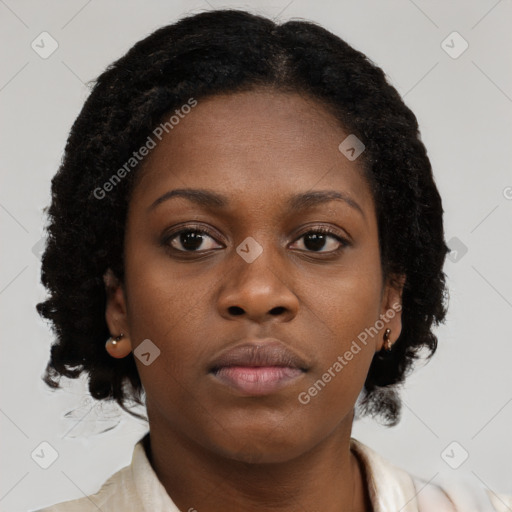 Neutral black young-adult female with medium  brown hair and brown eyes