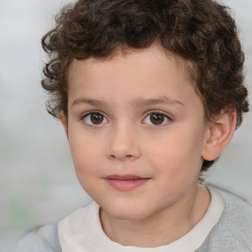 Joyful white child male with short  brown hair and brown eyes