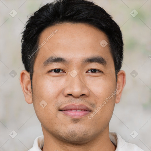 Joyful asian young-adult male with short  black hair and brown eyes