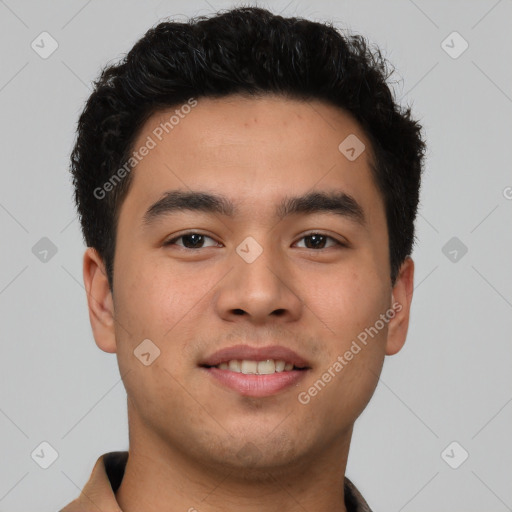 Joyful latino young-adult male with short  brown hair and brown eyes