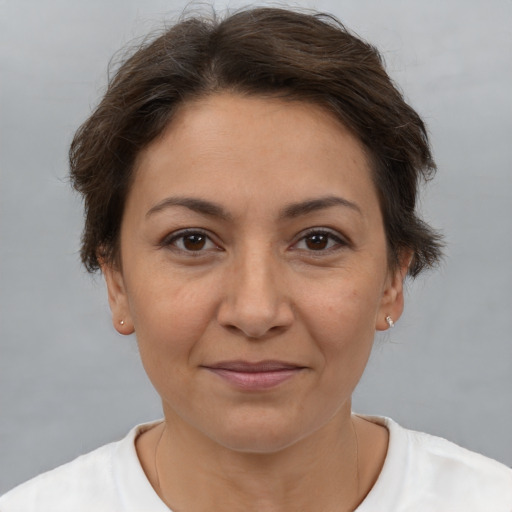 Joyful white adult female with short  brown hair and brown eyes