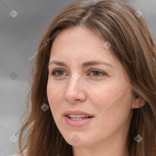 Joyful white adult female with long  brown hair and brown eyes