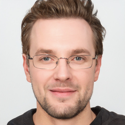 Joyful white adult male with short  brown hair and grey eyes