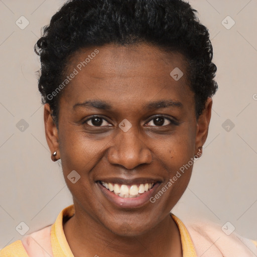 Joyful black young-adult female with short  brown hair and brown eyes