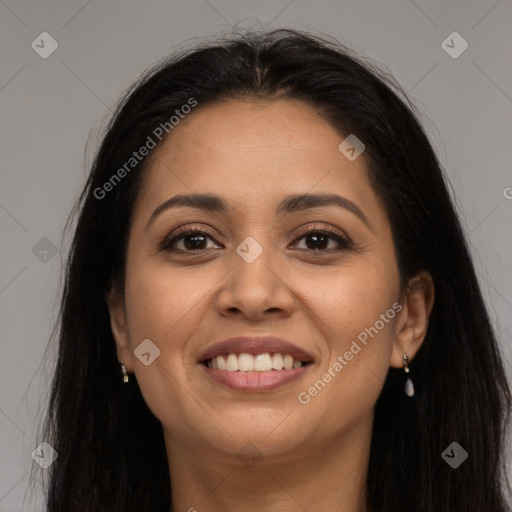 Joyful latino young-adult female with long  brown hair and brown eyes