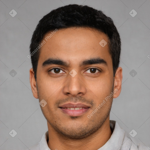 Joyful latino young-adult male with short  black hair and brown eyes