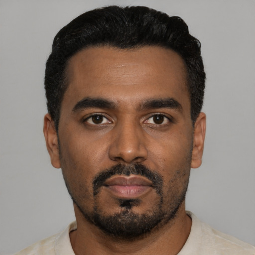 Neutral black young-adult male with short  black hair and brown eyes