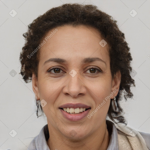 Joyful latino adult female with short  brown hair and brown eyes