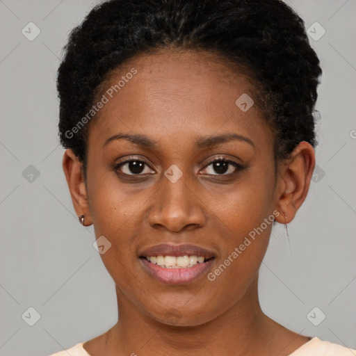 Joyful black young-adult female with short  brown hair and brown eyes