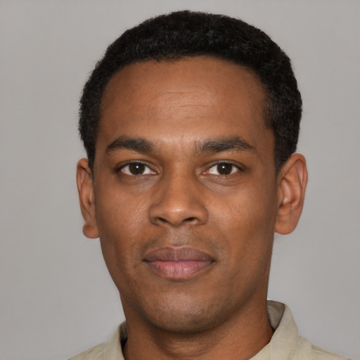 Neutral black young-adult male with short  black hair and brown eyes
