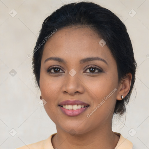 Joyful latino young-adult female with medium  brown hair and brown eyes