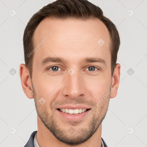 Joyful white young-adult male with short  brown hair and grey eyes