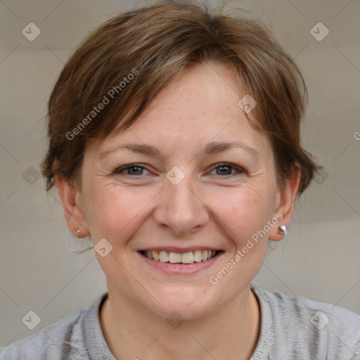 Joyful white adult female with medium  brown hair and grey eyes