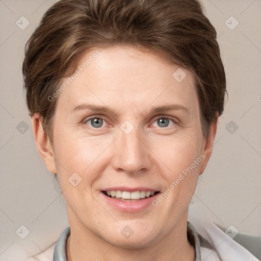 Joyful white adult female with short  brown hair and grey eyes