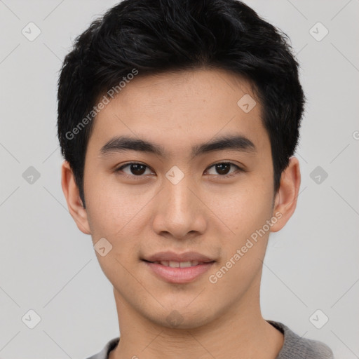 Joyful asian young-adult male with short  black hair and brown eyes