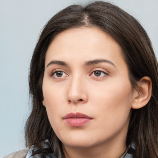 Neutral white young-adult female with long  brown hair and brown eyes