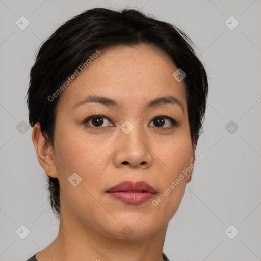 Joyful asian adult female with medium  brown hair and brown eyes