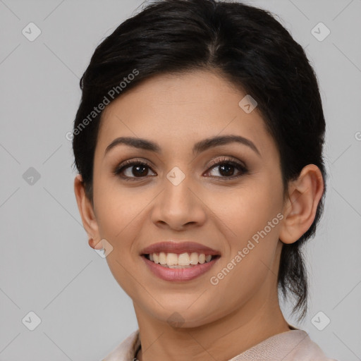 Joyful latino young-adult female with medium  brown hair and brown eyes