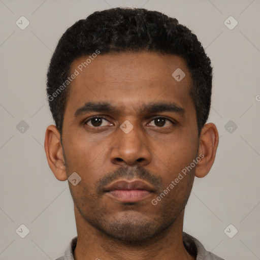 Neutral latino young-adult male with short  black hair and brown eyes