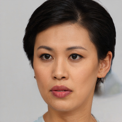 Neutral asian young-adult female with short  black hair and brown eyes