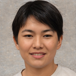 Joyful asian young-adult female with short  brown hair and brown eyes