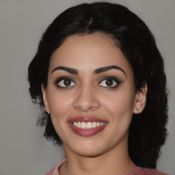 Joyful latino young-adult female with medium  black hair and brown eyes