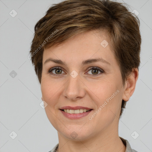 Joyful white young-adult female with short  brown hair and grey eyes