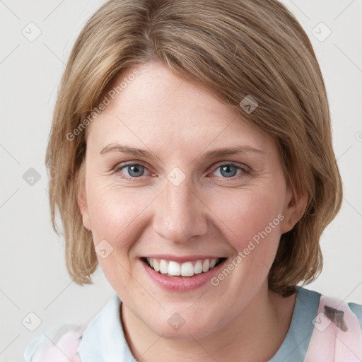 Joyful white young-adult female with medium  brown hair and blue eyes