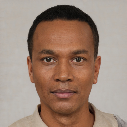 Neutral black young-adult male with short  black hair and brown eyes