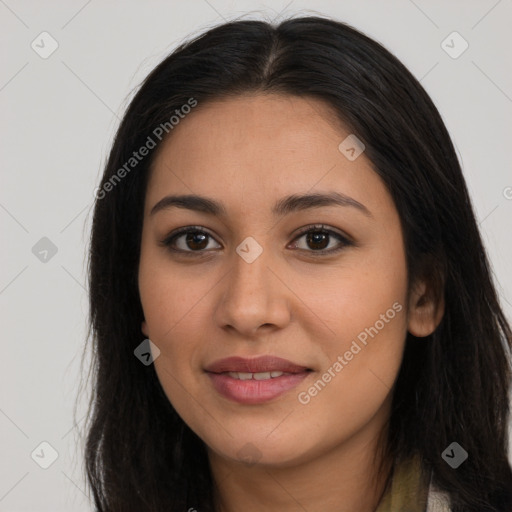 Joyful latino young-adult female with long  brown hair and brown eyes