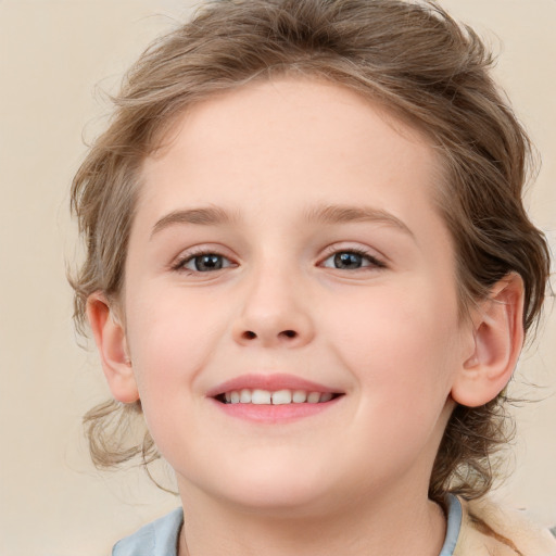 Joyful white child female with medium  brown hair and blue eyes