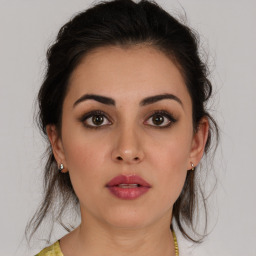 Neutral white young-adult female with medium  brown hair and brown eyes