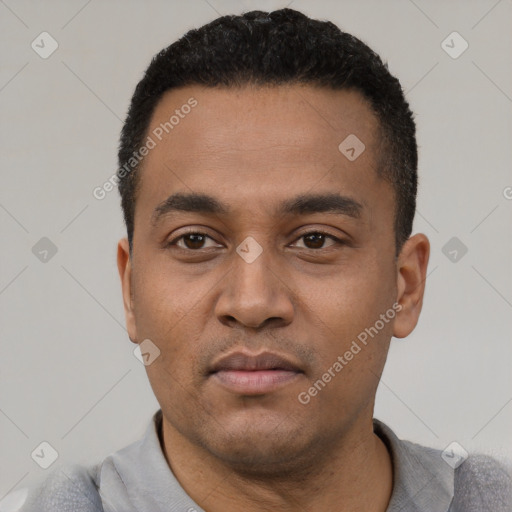 Neutral latino young-adult male with short  black hair and brown eyes