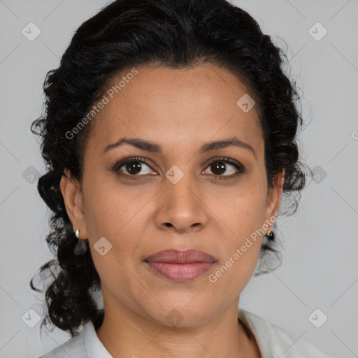 Joyful latino adult female with medium  brown hair and brown eyes