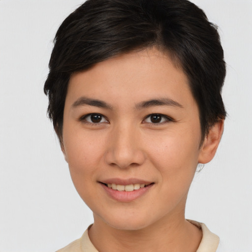 Joyful asian young-adult female with short  brown hair and brown eyes