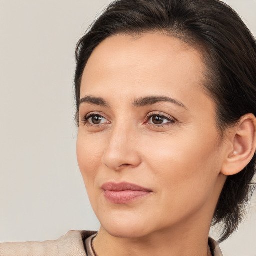 Joyful white young-adult female with medium  brown hair and brown eyes