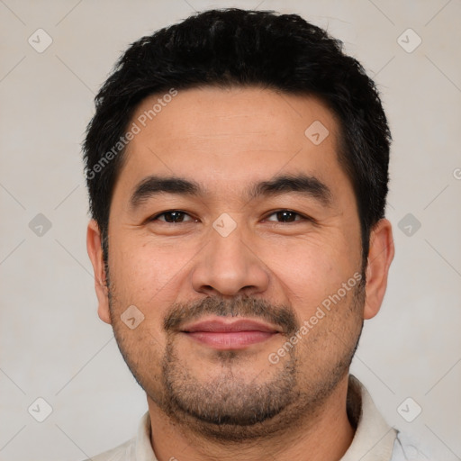 Joyful latino young-adult male with short  black hair and brown eyes