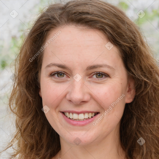 Joyful white young-adult female with long  brown hair and green eyes