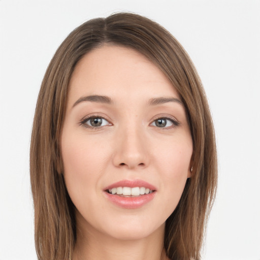 Joyful white young-adult female with long  brown hair and grey eyes